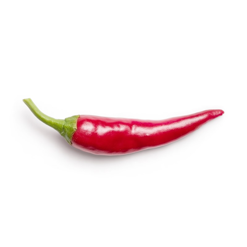 Fresh hot peppers on white background