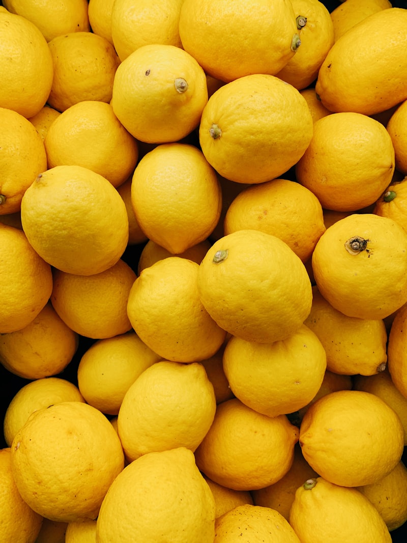 Fresh lemons on white background